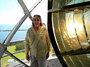 DF Cynthia Gonyea, KJ6GPG, illuminated by Fresnel lens